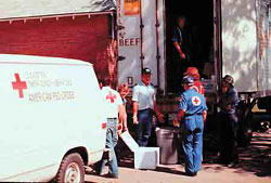 Red Cross workers set up food and water for victims of the June 3, 1980 tornadoes. 